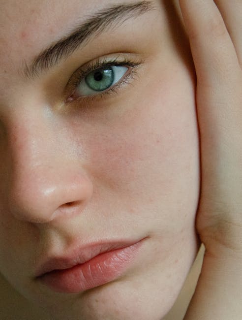 Close-up portrait showcasing natural skin texture and eye detail, emphasizing beauty and authenticity.